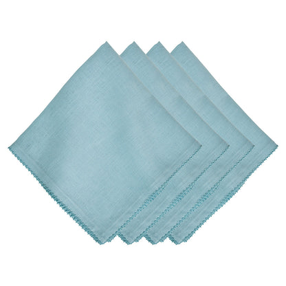 Set of four light blue Berry Scallop Napkins from Juliska, featuring a decorative stitched scalloped edge and neatly stacked on a white background.
