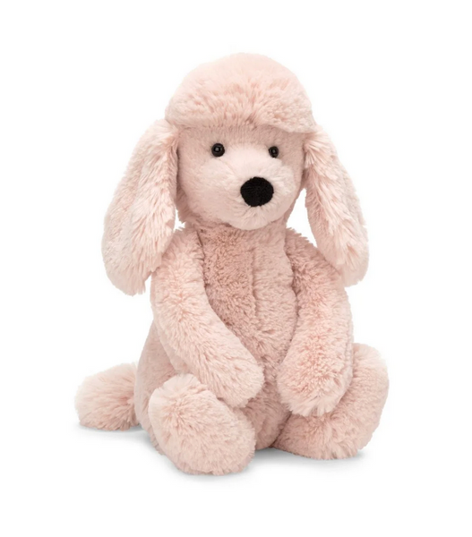 Bashful, the pink fluffy poodle by Jellycat against a white background.