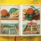 An open book, "The Book of Citrus" by Taschen, reveals intricate copper plates with citrus fruit illustrations and garden designs on a textured yellow background, evoking classic Italian villas.