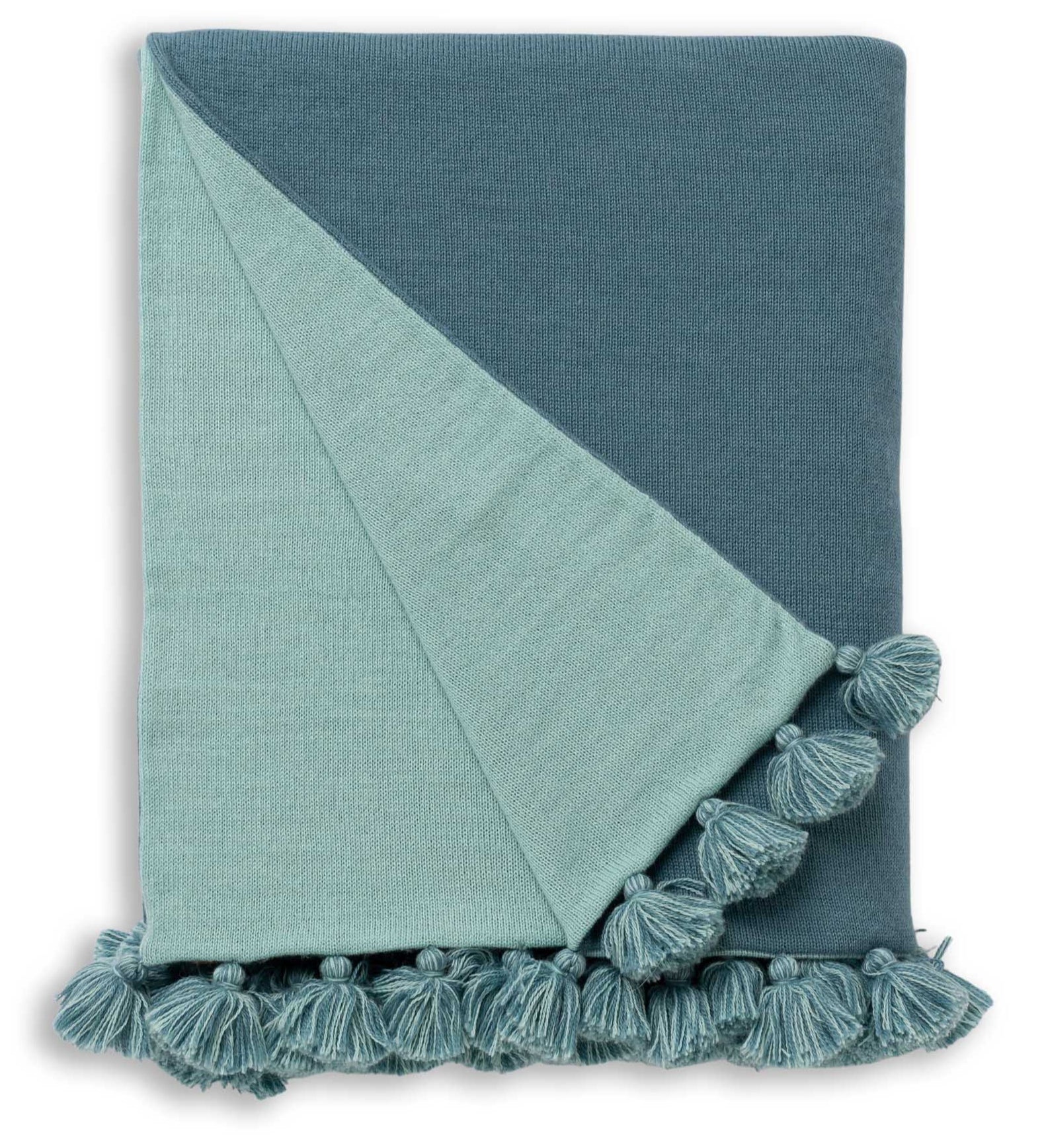 The Bali Throw in Teal/Aqua by Alicia Adams Alpaca, made from hypoallergenic alpaca wool with tasseled edges and a reversible design, is displayed against a white background.