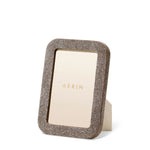 The Aerin Modern Shagreen Frame features a minimalist design with a gold border.