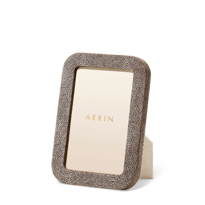 The Aerin Modern Shagreen Frame features a minimalist design with a gold border.