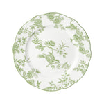 The Albertine Collection by Bernardaud features a white plate with scalloped edges and a green floral bird motif inspired by toile de Jouy, adding poetic elegance to your table setting.