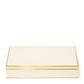 The Aerin Luxe Shagreen Mahjong Set in cream features a rectangular, cream-colored box with gold trim—perfect for storing vibrantly engraved tiles and adding a touch of luxury to your game nights.