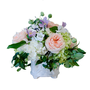 A Hive Floral Studio Live Designer's Choice Floral Arrangement of pink and white flowers in a white vase.