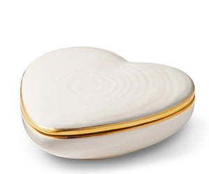 The Cream Calinda Heart Box by Aerin is a white, heart-shaped ceramic box with gold detailing on the lid, shown against a plain white background.