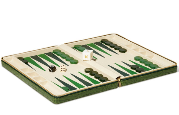 Open the AERIN Enzo Backgammon Travel Set, Verde to find black and green checkers, two dice, and a doubling cube on a green and white board, all housed in an elegant Italian croc-embossed leather case by Aerin.