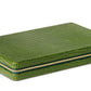 The Enzo Backgammon Travel Set, Verde by Aerin is a compact case in green Italian croc-embossed leather, featuring a striking texture and gold zipper for secure closure.