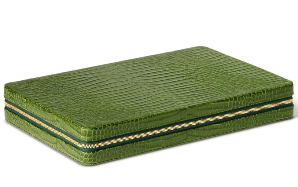 The Enzo Backgammon Travel Set, Verde by Aerin is a compact case in green Italian croc-embossed leather, featuring a striking texture and gold zipper for secure closure.