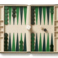 The Enzo Backgammon Travel Set, Verde by Aerin features Italian croc-embossed leather, green and dark green checkers set for play, two dice showing 3 and 2, a doubling cube, all on a compact cream and green surface.