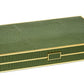 AERIN’s Croc Leather Backgammon Set comes in a rectangular green crocodile-finish box with gold trim and a centered gold latch, offering an elegant way to store your Italian leather game set.
