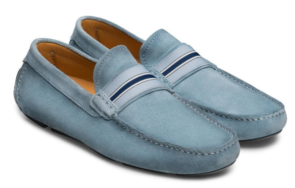 Here is the modified sentence with the given product name and brand name:

"Pair of Magnanni Loira Loafer with a supple suede upper and contrasting dark blue and white striped bands across the instep.