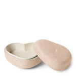 The Aerin Shagreen Heart Box Collection features a small, heart-shaped box with a textured pink shagreen finish and matching lid, revealing a soft interior—ideal for storing keepsakes.