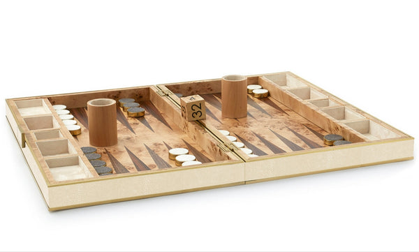 The AERIN Shagreen Backgammon Set in Cream by Aerin features an open board with beige and brown triangles, dice, a doubling cube, and black and white checkers, all highlighting its contemporary design.