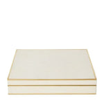 The Aerin Shagreen Chess Set Collection features a closed, rectangular cream-colored shagreen box with gold trim, displayed against a white background.