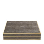 The Aerin Shagreen Chess Set Collection features a rectangular, flat-lidded box with a textured dark grey shagreen surface and light edges, shown against a white background.