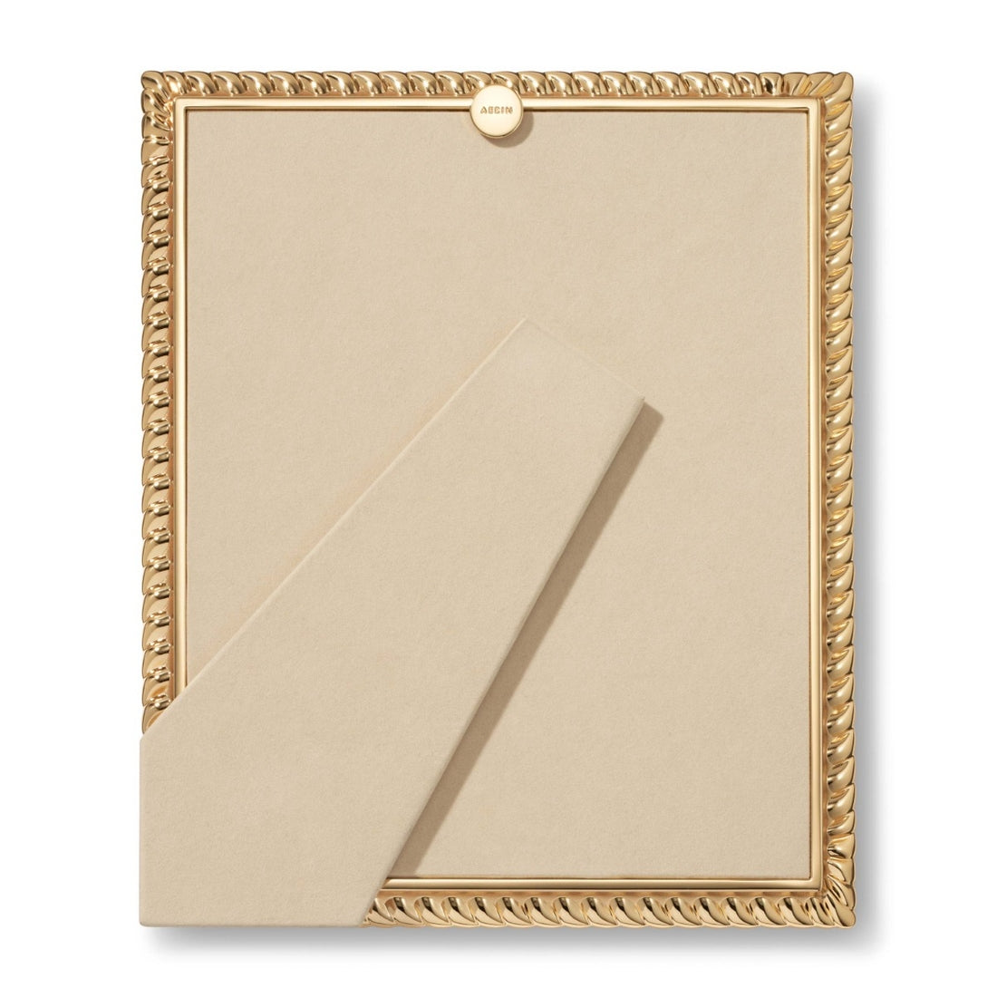 The Loretta Frame Collection by Aerin features a gold frame with beige backing and stand, showcasing a subtle twist design, viewed from the back against a plain white background.