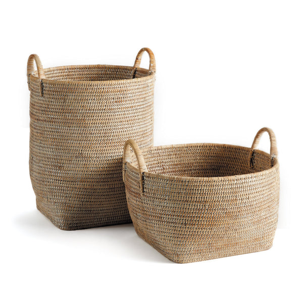 The Napa Home & Garden Burma Whitewash Rattan Orchard Basket Collection, featuring two baskets—one tall and one short with rounded handles—creates an elegant organizing solution on a white background.