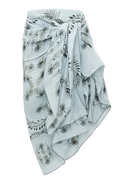 A blue and white Dorothee Schumacher Printed Summer Pareo draped elegantly, forming cascading folds and layers.