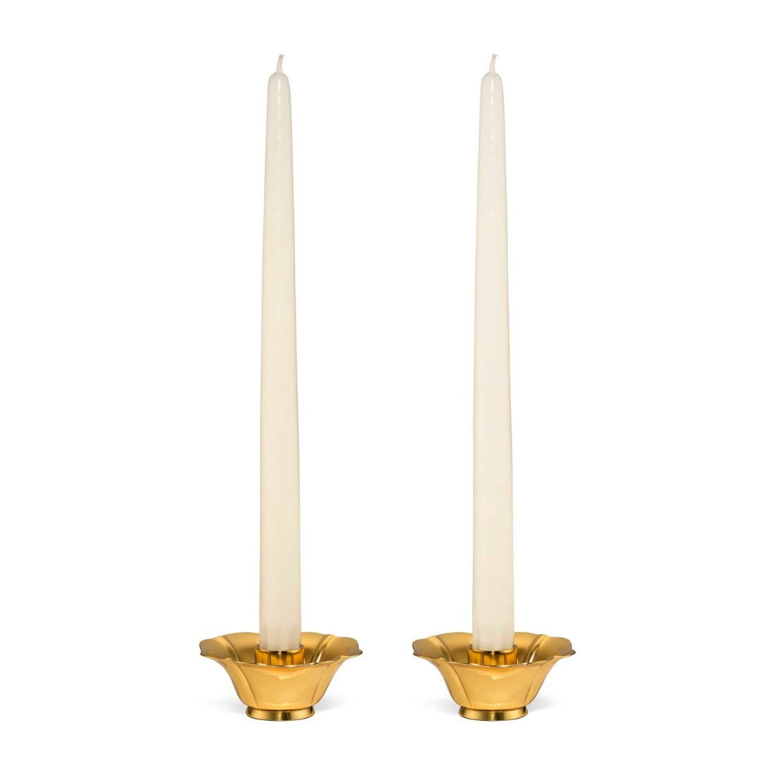 Two white taper candles stand in the Olivia Brass Taper Candleholder Set by Aerin, featuring elegant brass holders with a hint of Art Deco style, set against a plain white background.
