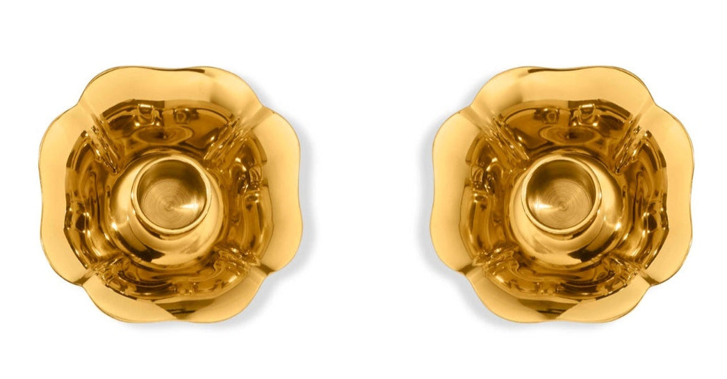 Two gold-toned Olivia Brass Taper Candleholders by Aerin, featuring a vintage flower-shaped design, are displayed side by side on a white background.