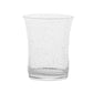 The Juliska Provence Basil Drinkware Collection features clear glasses with a slightly flared rim and bubble-like texture, inspired by Provence and classic mouth-blown Juliska tumblers.
