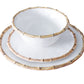 A white bowl and two stacked white plates with bamboo-style rims are shown on a white background. The Beatriz Ball Vida Natural Bamboo Dinnerware Collection is crafted from luxury melamine for style and break resistance.