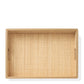 The Colette Cane Tray by Aerin features a woven rattan base, white oak trim, and two side handles, displayed from above against a white background.