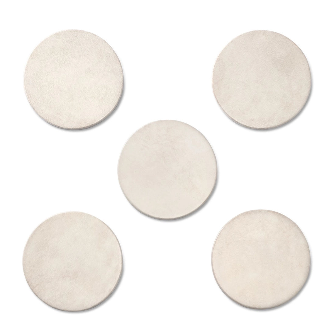 The Aerin Livio Parchment Coaster Set features five round, beige leather coasters with brass accents, arranged in a central and surrounding pattern on a white background for a touch of Art Deco elegance.