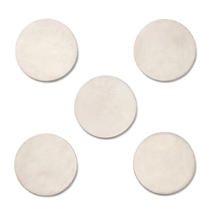 The Aerin Livio Parchment Coaster Set features five round, beige leather coasters with brass accents, arranged in a central and surrounding pattern on a white background for a touch of Art Deco elegance.