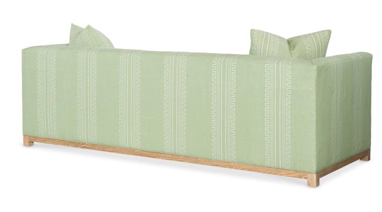 A Highland House Barrow Sofa in light green with a Green Greco Stripe geometric pattern, wooden base, and two matching back cushions is shown from the back.
