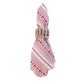 A folded Juliska Red Villa Stripe Napkin with a red jacquard stripe pattern held by a woven light-colored napkin ring.
