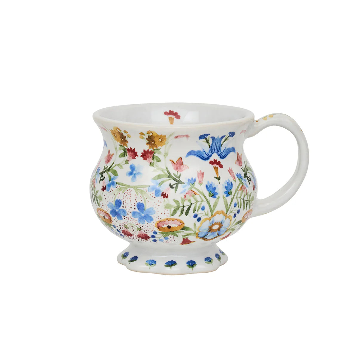The Sofia Serveware Collection by Juliska features a white footed ceramic mug with a curved handle and a vibrant fantasy floral design—an ideal way to add charm to your tableware.