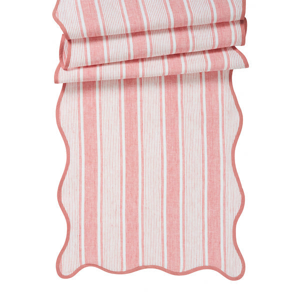 The Juliska Cabana Stripe Tabletop Collection features folded red and white striped fabric with breezy, wavy edges.