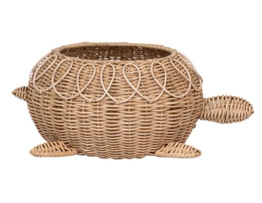 Introducing the Juliska Provence Rattan Turtle Bowl by Juliska, a delightful piece that showcases a hand-woven wicker basket shell. This charming design features a round body, four legs, and a head, highlighting its exquisite natural texture.