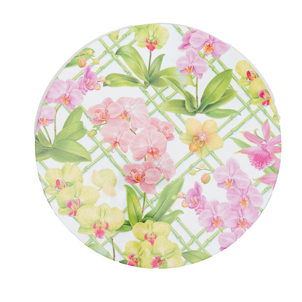 The Caspari Orchid Conservatory Collection round plate features pink, yellow, and purple orchids with green leaves on a white background with a light green lattice—ideal for stylish table settings or party themes.