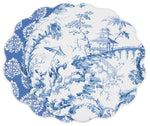 Two scalloped-edge plates—one with a blue-and-white pastoral scene, the other with a floral motif—pair beautifully with the Beatriz Ball VIDA Chinoiserie Reversible Round Placemat.