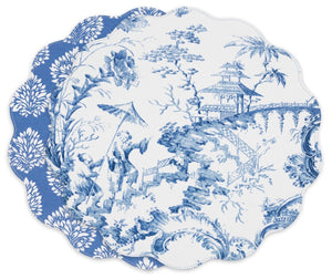 Two scalloped-edge plates—one with a blue-and-white pastoral scene, the other with a floral motif—pair beautifully with the Beatriz Ball VIDA Chinoiserie Reversible Round Placemat.