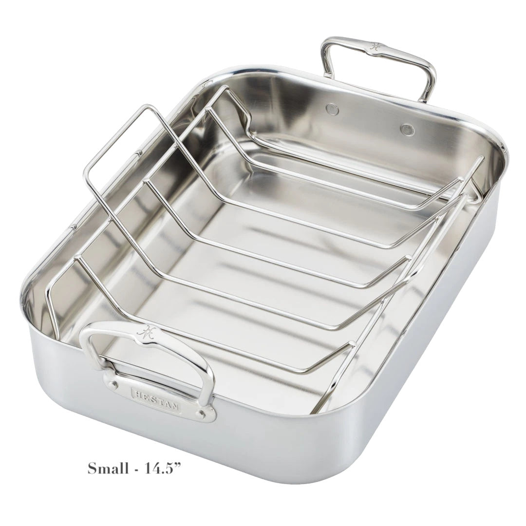 The Hestan Provisions Classic Clad Roaster with Rack Collection features stainless steel tri-ply construction, two handles, a metal rack, and is labeled "Small - 14.5”" at the bottom left corner.
