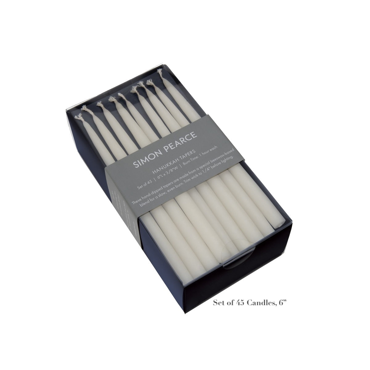 A box of 45 ivory 6-inch artisan candles from the Simon Pearce Ivory Candle Collection, featuring a gray label—perfect for adding a warm, handcrafted touch to your home.