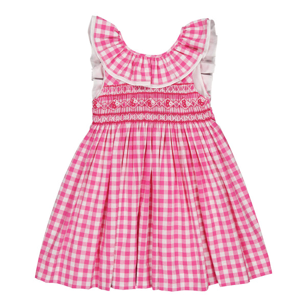 A Kidiwi Melina Smocked Dress, a pink and white checkered cotton summer dress with decorative embroidery and smocked detailing on the waistband, isolated on a white background.