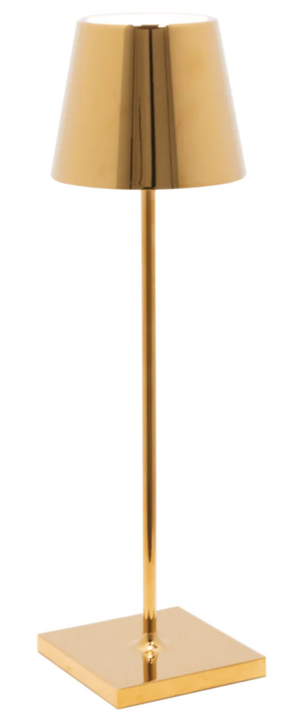 The Zafferano America Poldina Pro Lamp Collection features a gold-colored, rechargeable lamp with a conical shade, slender stem, and square base for cordless illumination, shown against a plain white background.