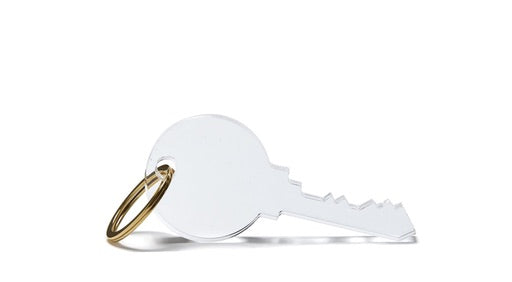The Tara Wilson Designs Acrylic Key Chain Collection features a single silver key with a round head on a small gold keyring, adding simple style to your keys against a white background.