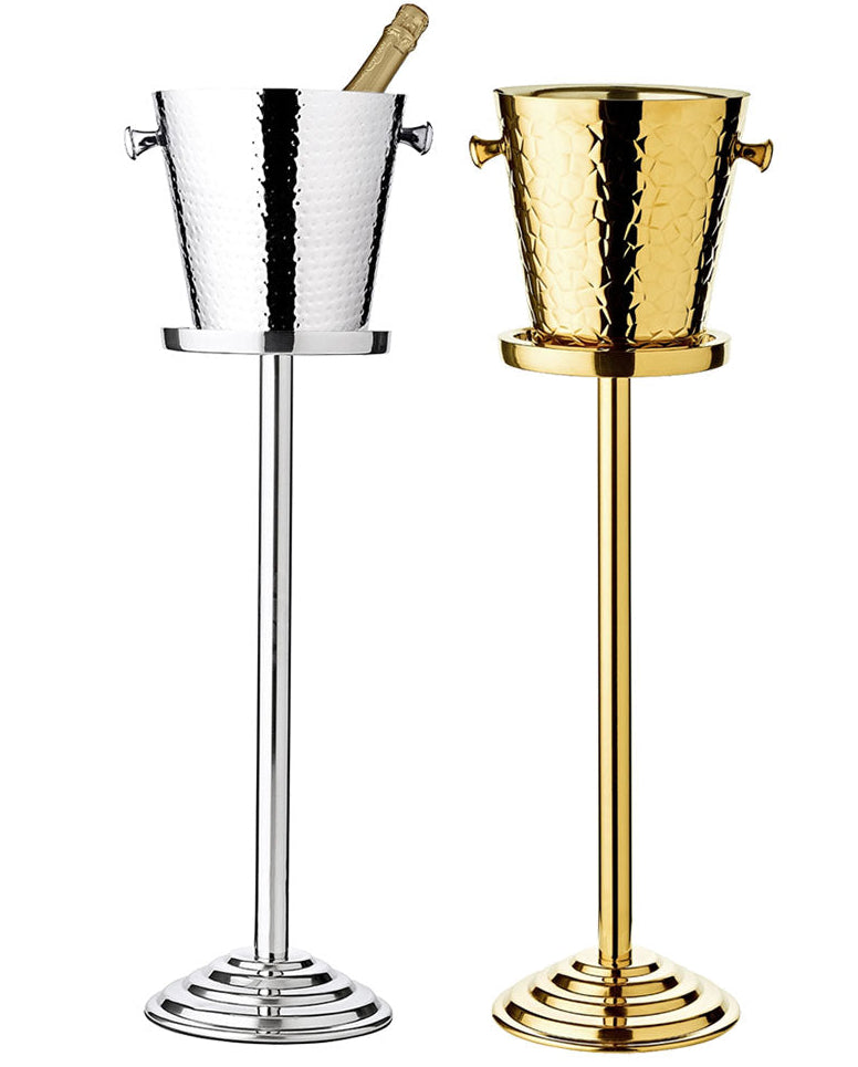 The EDZARD Capri Ice Bucket with Stand Collection features hammered stainless steel and gold buckets on tall stands, echoing luxury hotel sophistication with their elegant side-by-side display.