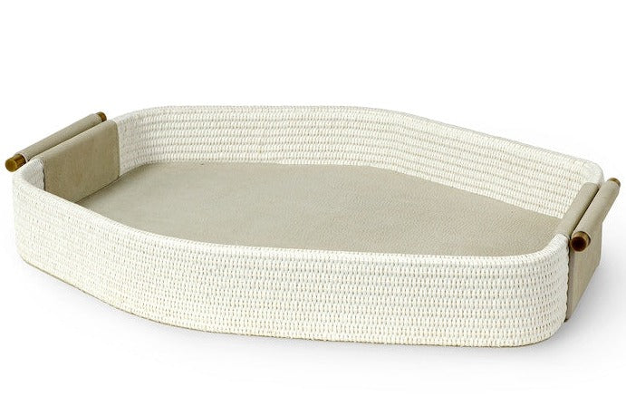 A rectangular, woven tray with antique brass handles on each end, featuring a flat, solid surface in the center, the Nicollet Tray by PALECEK.