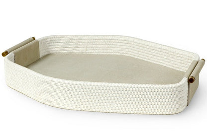 A rectangular, woven tray with antique brass handles on each end, featuring a flat, solid surface in the center, the Nicollet Tray by PALECEK.