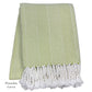 The Nantucket Herringbone Throw Collection by A Soft Idea features a pistachio green and white chevron design in soft cotton, finished with hand-knotted fringe tassels.