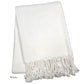 The Nantucket Herringbone Throw Collection by A Soft Idea features crisp white cotton, a subtle pattern, and elegant hand-knotted fringe along one edge.