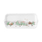 The Juliska Berry & Thread North Pole Dinnerware and Serveware Collection features a rectangular ceramic tray with a winter village scene, ideal as a holiday layering plate for festive gatherings.