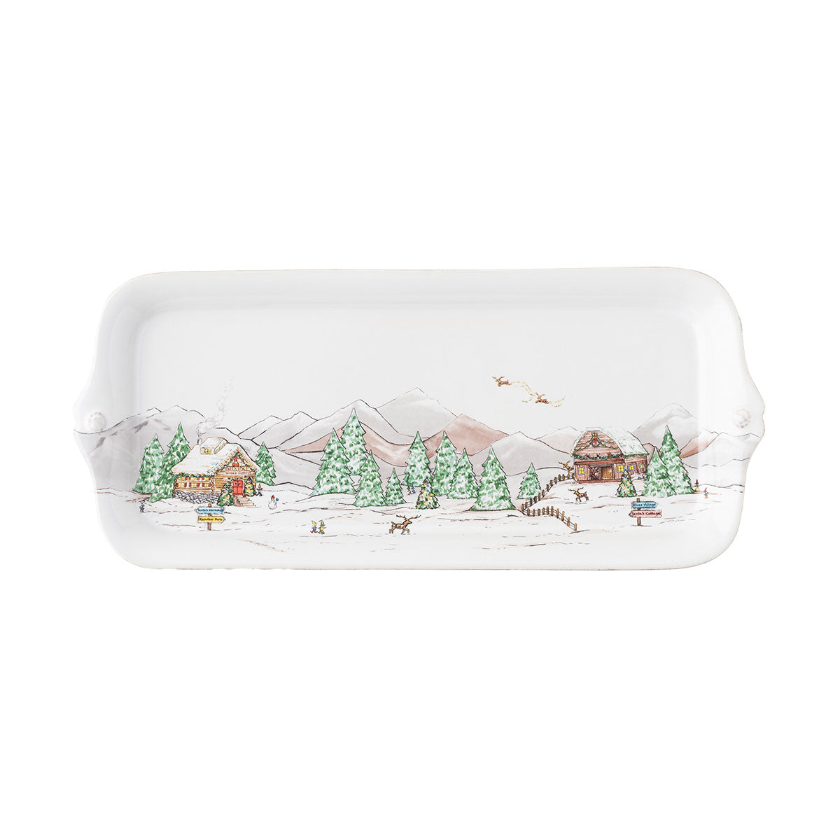 The Juliska Berry & Thread North Pole Dinnerware and Serveware Collection features a rectangular ceramic tray with a winter village scene, ideal as a holiday layering plate for festive gatherings.